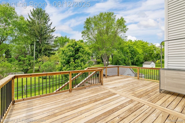 11213 Youngstree Ct, Davisburg, MI 48350 - wooden deck with a yard and view of scattered trees