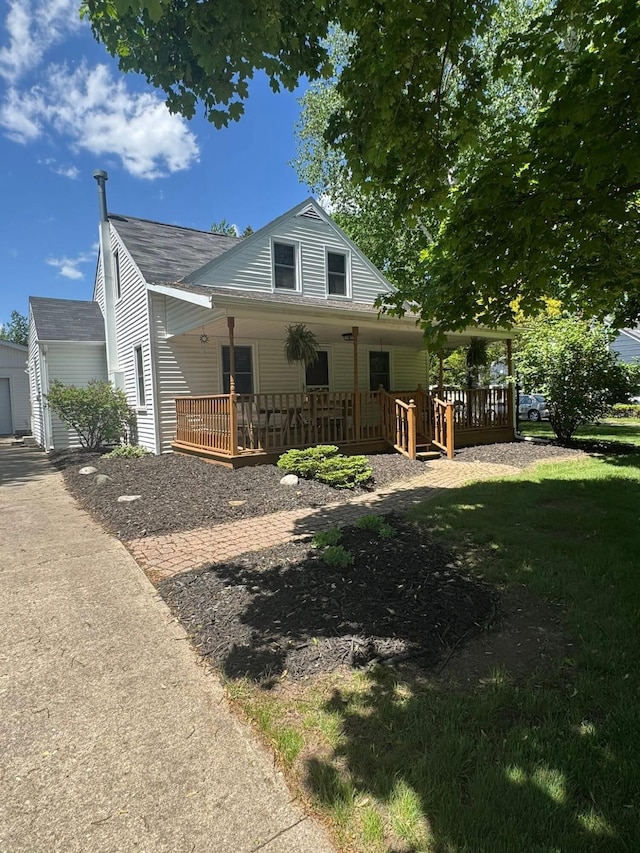 829 S Union St, Tecumseh, MI 49286 - view of front of home with covered porch and roof with shingles