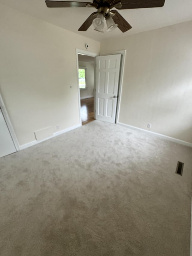 829 S Union St, Tecumseh, MI 49286 - unfurnished bedroom with baseboards, carpet, and ceiling fan