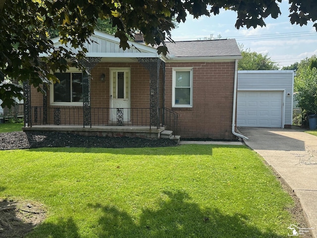 653 Huber Dr, Monroe, MI 48162 - view of front of house featuring brick siding, a front yard, driveway, a garage, and a porch
