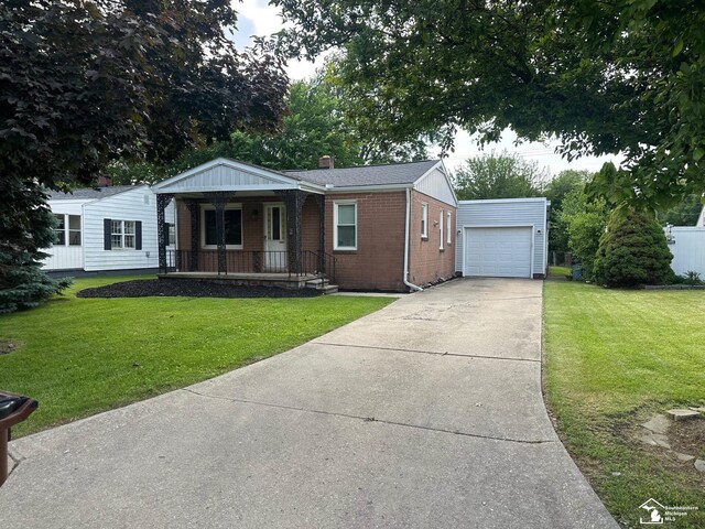 653 Huber Dr, Monroe, MI 48162 - view of front of home featuring covered porch, brick siding, driveway, and a front yard