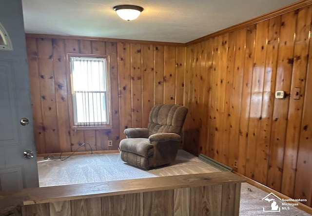 653 Huber Dr, Monroe, MI 48162 - sitting room featuring wood walls, carpet, and ornamental molding