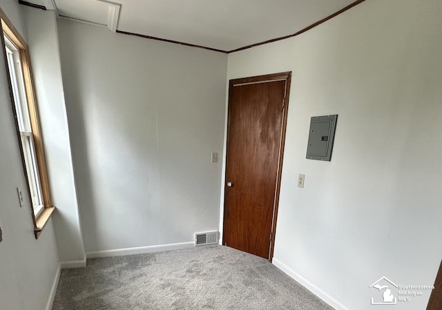 653 Huber Dr, Monroe, MI 48162 - carpeted empty room featuring electric panel and ornamental molding