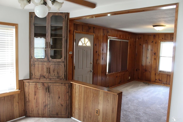 653 Huber Dr, Monroe, MI 48162 - foyer featuring wood walls and light colored carpet