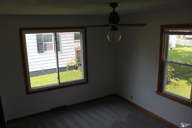 653 Huber Dr, Monroe, MI 48162 - spare room with plenty of natural light, dark carpet, and ceiling fan