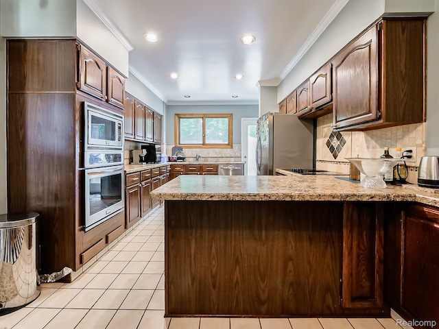 19394 Ingram Dr, Shelby Twp, MI 48038 - kitchen with appliances with stainless steel finishes, ornamental molding, a peninsula, backsplash, and light countertops