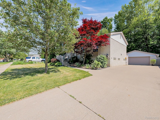 19394 Ingram Dr, Shelby Twp, MI 48038 - obstructed view of property featuring a front lawn, an outdoor structure, a garage, and brick siding
