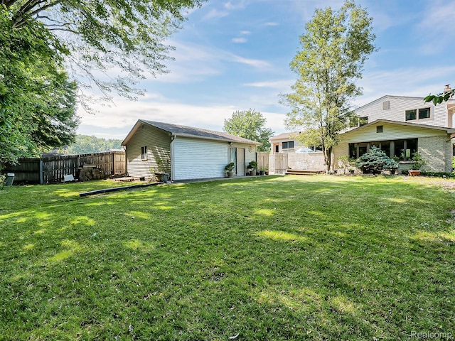 19394 Ingram Dr, Shelby Twp, MI 48038 - view of yard with an outbuilding
