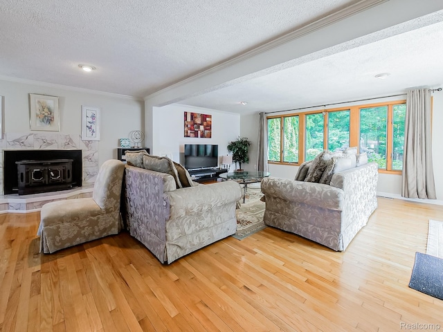 19394 Ingram Dr, Shelby Twp, MI 48038 - living room with a textured ceiling, ornamental molding, light wood finished floors, and a wood stove