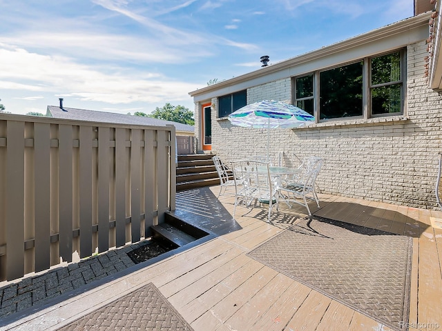 19394 Ingram Dr, Shelby Twp, MI 48038 - wooden terrace with outdoor dining space