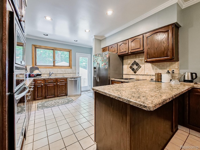 19394 Ingram Dr, Shelby Twp, MI 48038 - kitchen featuring stainless steel appliances, a peninsula, decorative backsplash, ornamental molding, and light countertops