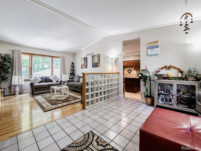 19394 Ingram Dr, Shelby Twp, MI 48038 - living area featuring light tile patterned flooring, ornamental molding, and vaulted ceiling
