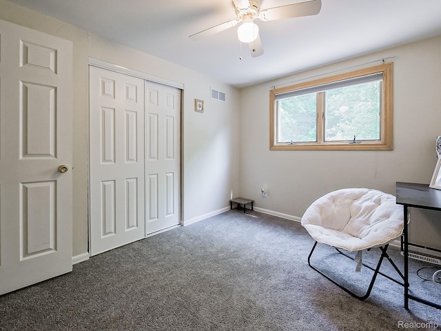 19394 Ingram Dr, Shelby Twp, MI 48038 - living area featuring dark carpet and ceiling fan