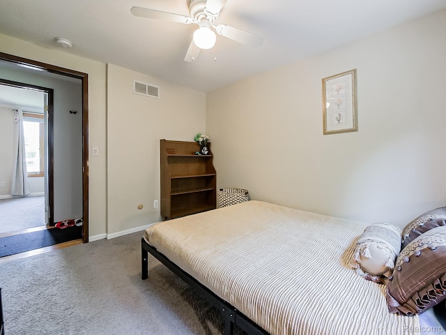 19394 Ingram Dr, Shelby Twp, MI 48038 - carpeted bedroom with baseboards and ceiling fan