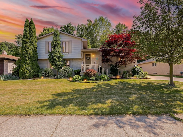 19394 Ingram Dr, Shelby Twp, MI 48038 - split level home with brick siding and a front yard