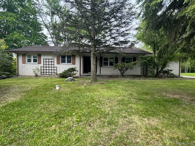 1396 Westerrace Dr, Flint, MI 48532 - view of front of home with brick siding and a front lawn