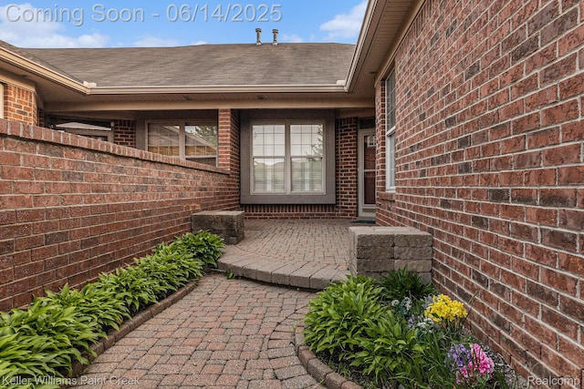 50021 Ludwig Ct, Shelby Twp, MI 48317 - entrance to property featuring brick siding and roof with shingles