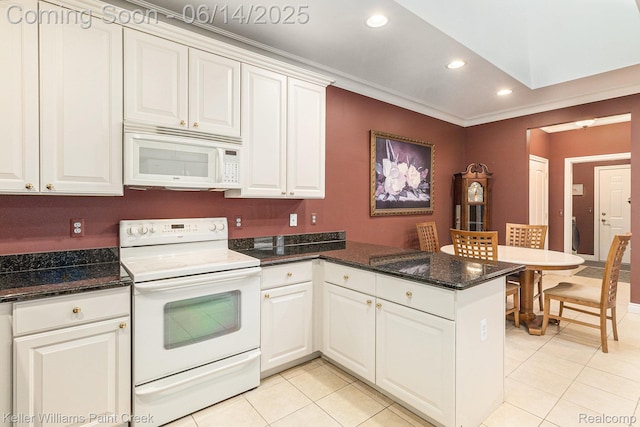 50021 Ludwig Ct, Shelby Twp, MI 48317 - kitchen featuring white appliances, a peninsula, light tile patterned floors, recessed lighting, and white cabinets