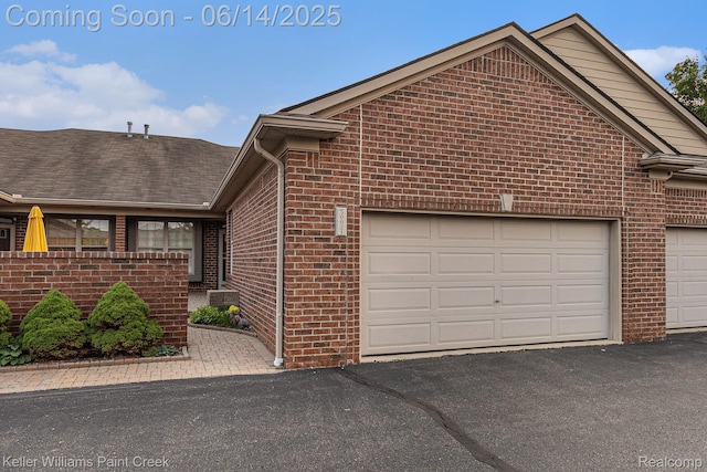 50021 Ludwig Ct, Shelby Twp, MI 48317 - view of front of house featuring brick siding and driveway