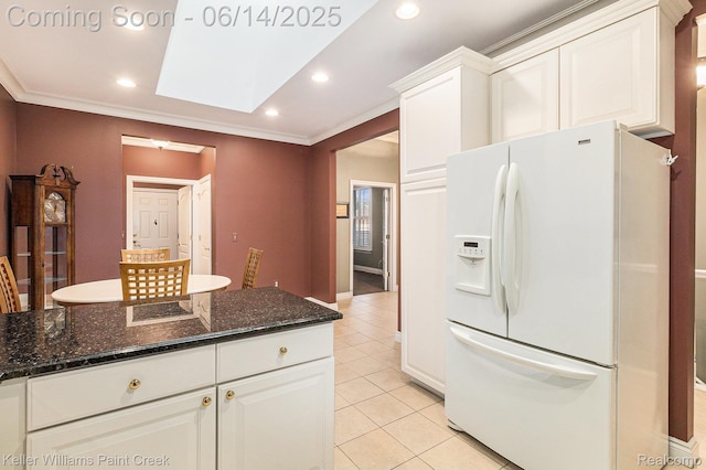 50021 Ludwig Ct, Shelby Twp, MI 48317 - kitchen featuring white refrigerator with ice dispenser, light tile patterned floors, white cabinetry, recessed lighting, and ornamental molding