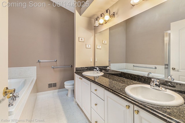 50021 Ludwig Ct, Shelby Twp, MI 48317 - full bath featuring a garden tub, double vanity, toilet, baseboards, and tile patterned floors