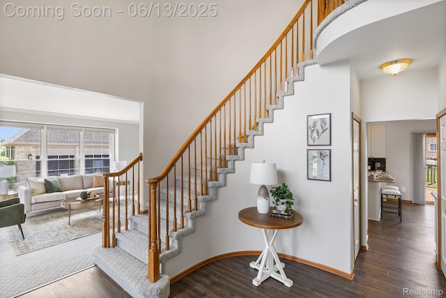 49093 Poppleton Ct, Canton, MI 48187 - staircase featuring a high ceiling and wood finished floors