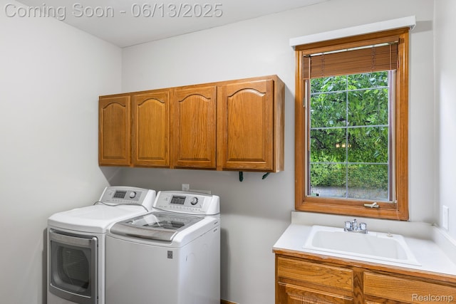 49093 Poppleton Ct, Canton, MI 48187 - laundry room with cabinet space and separate washer and dryer