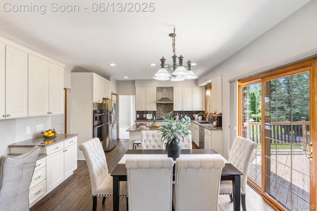 49093 Poppleton Ct, Canton, MI 48187 - dining space with a chandelier, dark wood-style flooring, and recessed lighting