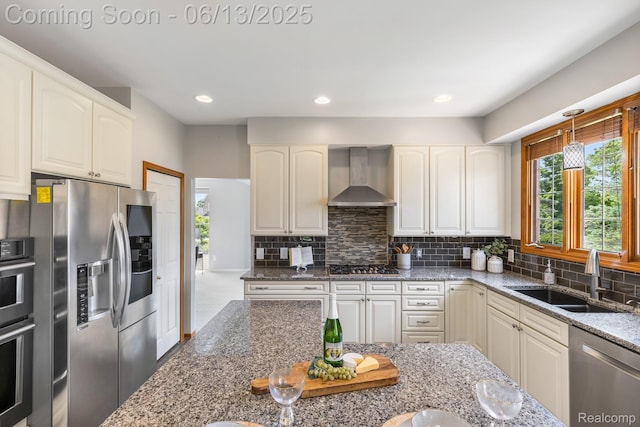49093 Poppleton Ct, Canton, MI 48187 - kitchen with wall chimney exhaust hood, appliances with stainless steel finishes, dark stone counters, backsplash, and hanging light fixtures