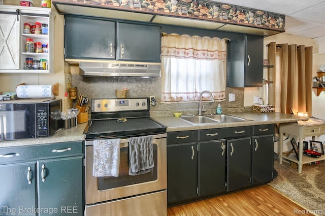 1329 Knight Ave, Flint, MI 48503 - kitchen featuring stainless steel electric range oven, a sink, black microwave, under cabinet range hood, and backsplash