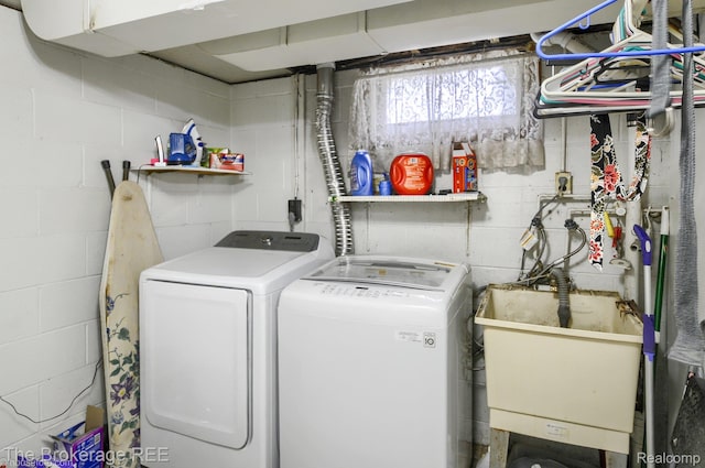 1329 Knight Ave, Flint, MI 48503 - laundry area with washer and dryer and concrete block wall