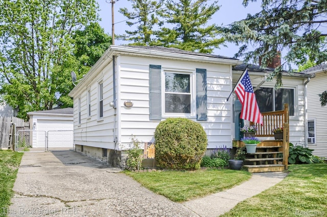1329 Knight Ave, Flint, MI 48503 - view of front of property featuring an outbuilding, a gate, and a detached garage