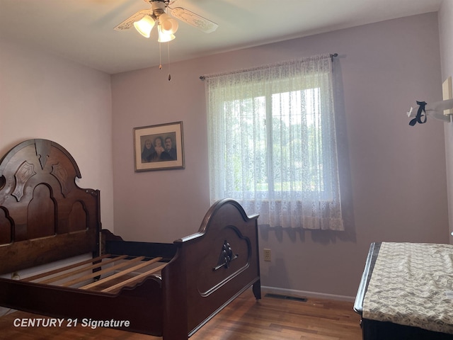 1045 N Pinecrest Ln, Grand Blanc, MI 48439 - bedroom featuring wood finished floors, baseboards, and ceiling fan