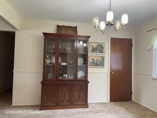 1045 N Pinecrest Ln, Grand Blanc, MI 48439 - carpeted dining area with a chandelier