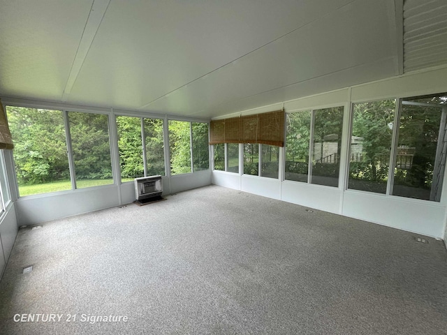 1045 N Pinecrest Ln, Grand Blanc, MI 48439 - unfurnished sunroom with a wood stove
