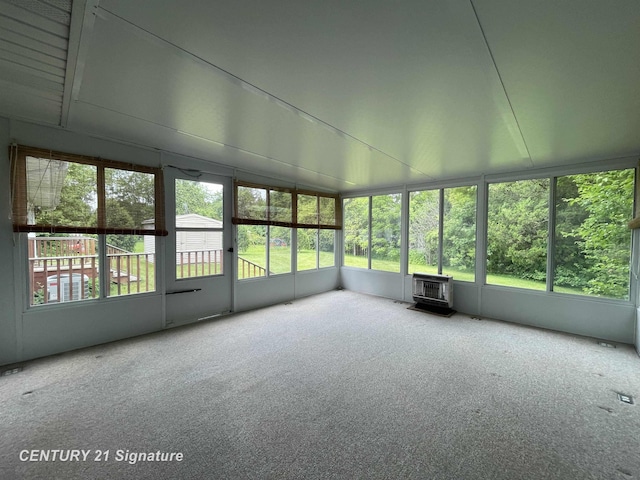 1045 N Pinecrest Ln, Grand Blanc, MI 48439 - unfurnished sunroom featuring a wood stove