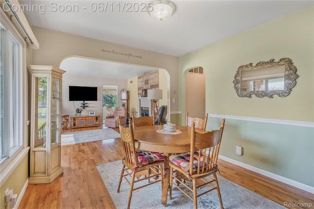 8351 Duffield Rd, Gaines, MI 48436 - dining space featuring arched walkways, plenty of natural light, and light wood-style flooring