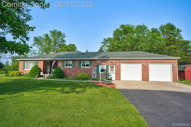 8351 Duffield Rd, Gaines, MI 48436 - ranch-style home featuring an attached garage, driveway, a front yard, brick siding, and a chimney
