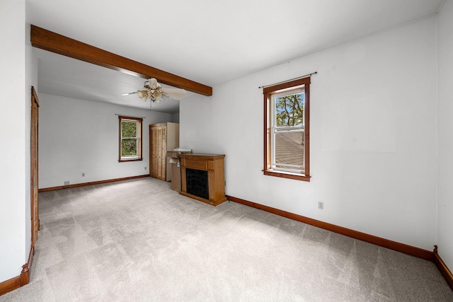 1820 E Rocky Weed Rd, Berrien Springs, MI 49103 - unfurnished living room featuring plenty of natural light, baseboards, a fireplace, and beam ceiling