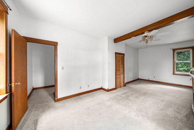 1820 E Rocky Weed Rd, Berrien Springs, MI 49103 - unfurnished room featuring carpet floors, a ceiling fan, baseboards, and beam ceiling