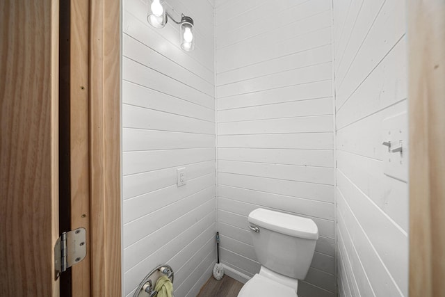 1820 E Rocky Weed Rd, Berrien Springs, MI 49103 - bathroom with toilet, wood walls, and wood finished floors