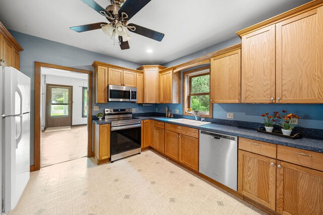 1820 E Rocky Weed Rd, Berrien Springs, MI 49103 - kitchen featuring appliances with stainless steel finishes, a sink, ceiling fan, recessed lighting, and dark countertops