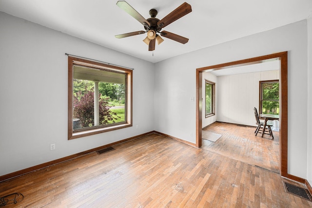 1820 E Rocky Weed Rd, Berrien Springs, MI 49103 - spare room featuring healthy amount of natural light, light wood-style flooring, and baseboards