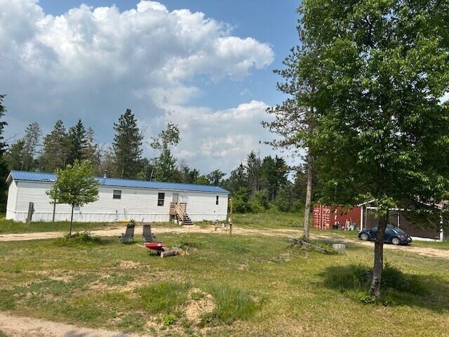 15754 N 10th Ave, Marion, MI 49665 - view of grassy yard with entry steps
