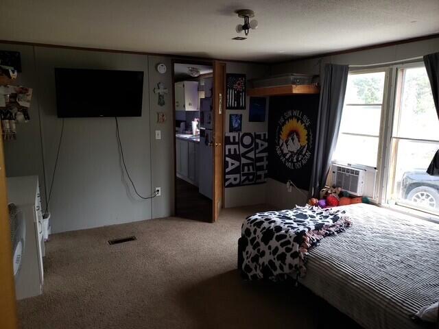 15754 N 10th Ave, Marion, MI 49665 - carpeted bedroom featuring cooling unit