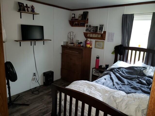 15754 N 10th Ave, Marion, MI 49665 - bedroom featuring wood finished floors