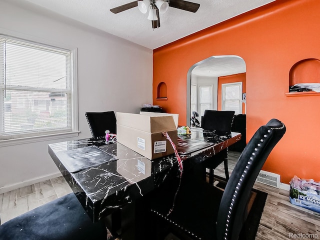 15882 Appoline St, Detroit, MI 48227 - office space featuring arched walkways, ceiling fan, plenty of natural light, and wood finished floors