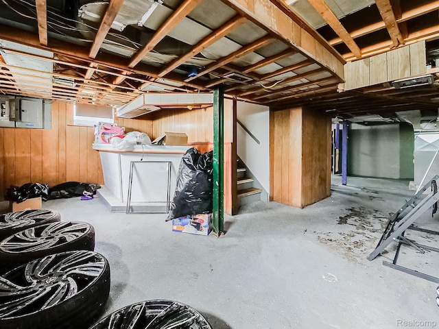 15882 Appoline St, Detroit, MI 48227 - below grade area with wooden walls, stairs, and electric panel