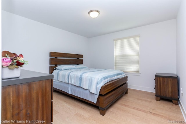 24738 Callaway Dr, Macomb, MI 48042 - bedroom featuring baseboards and light wood-style floors