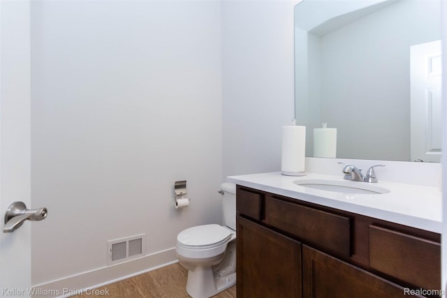 24738 Callaway Dr, Macomb, MI 48042 - half bath featuring vanity and wood finished floors